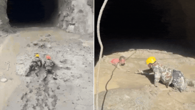 Dramatic rescue in Nepal as survivors crawl through mud from flood-hit tunnel – video